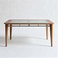 Glass top coffee table with wooden legs and metal accents 120 x 80 x 75cm